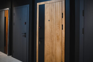 Showroom display of modern solid timber doors, highlighting options from a timber door supplier in Malaysia.